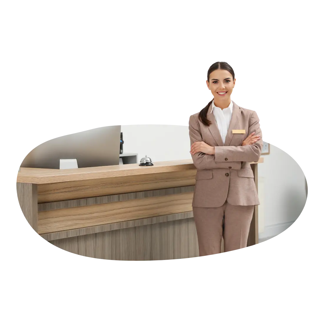 Hotel receptionist at front desk representing guest service challenges